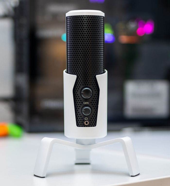 Close-up of a modern studio microphone with blurred background.
